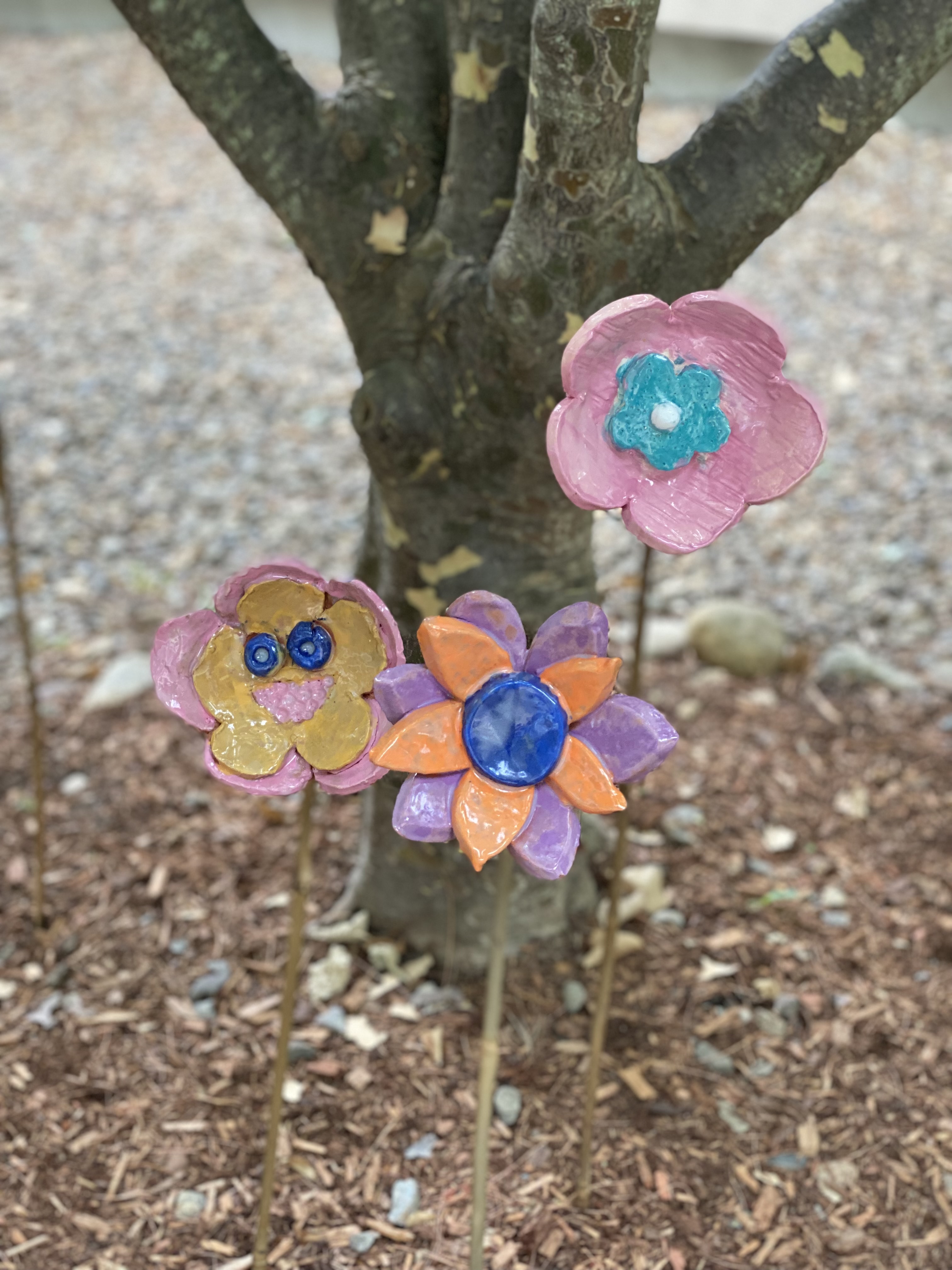 Close-up of handmade ceramic garden flowers